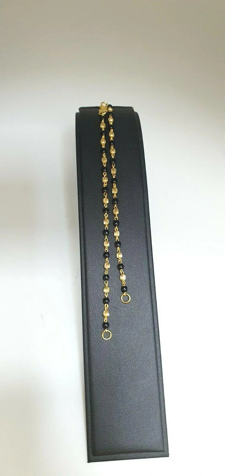 22ct Yellow Gold Baby Bracelet Black-beads With Diamond Cut Design