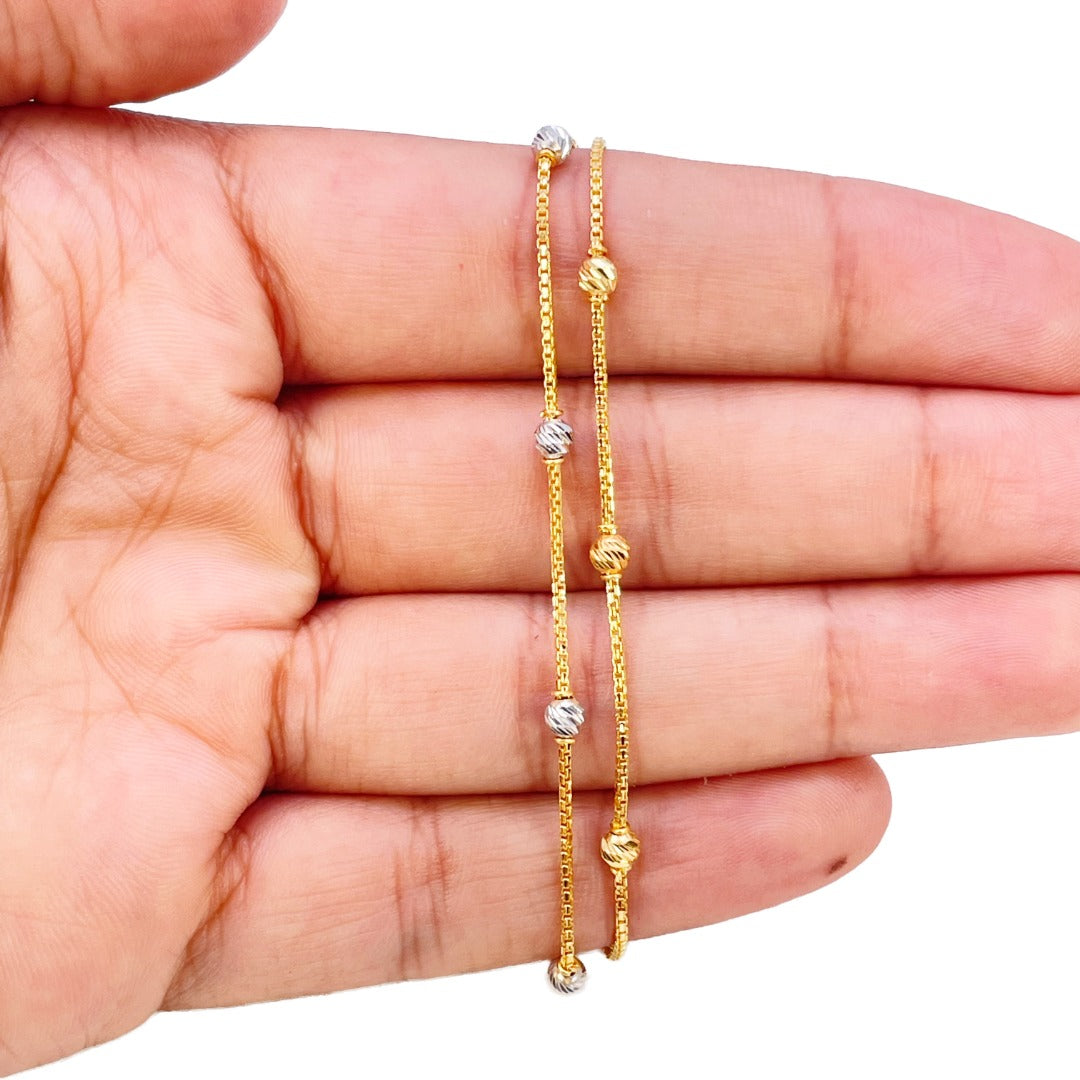22-karaats geelgouden dubbele ketting met tweekleurige diamantgeslepen kralen armband