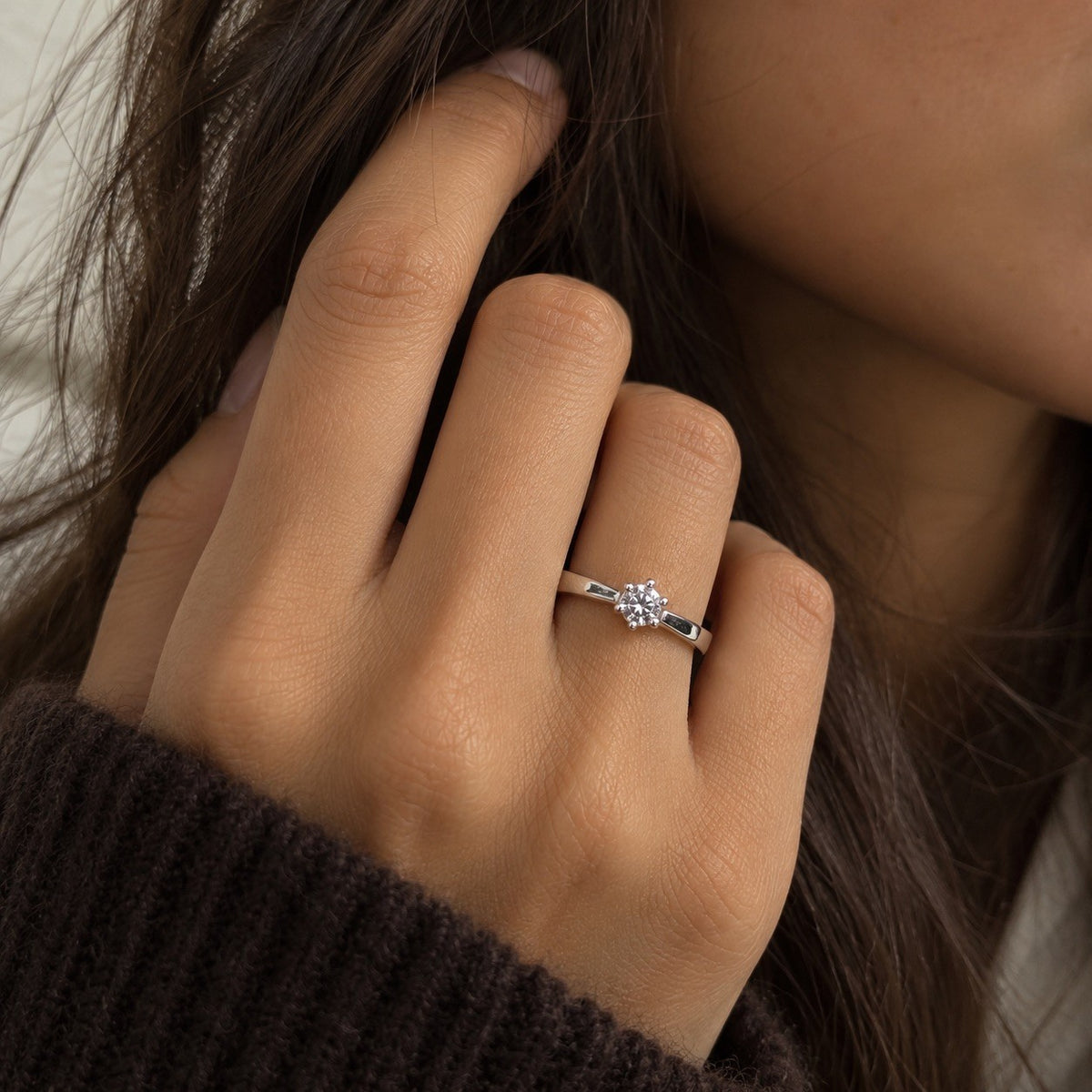 Close-up of 0.20ct round brilliant diamond in 14ct white gold six claw setting